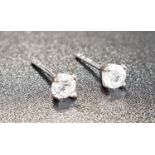 PAIR OF DIAMOND STUD EARRINGS the round cut diamonds totalling approximately 0.25cts, in nine