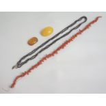 CORAL BRANCH NECKLACE 44cm long, a garnet bead necklace with sectional double rows, 71cm long, and