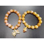 TWO SANDSTONE BEAD BRACELETS both with circular beads separated by small discs, one with single