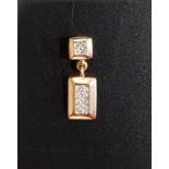 DIAMOND SET EIGHTEEN CARAT GOLD PENDANT the lower rectangular drop with eight diamonds below four