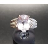 KUNZITE AND DIAMOND DRESS RING the central oval cut kunzite flanked by multi diamond set