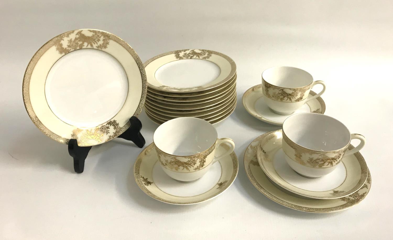 NORITAKE PART TEA SET with cream coloured and gilt border decoration, comprising seven cups,