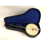 BRITISH MADE BANJO the mahogany neck with mother of pearl inlay and a circular stainless steel body,