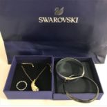 SELECTION OF SWAROVSKI JEWELLERY comprising a fern design pendant on chain, with box and bag, two