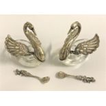 PAIR OF SILVER SWAN SALTS each swan with pierced wings and spoons with cherub finials, all marked