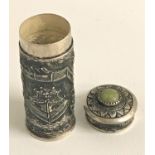 CHINESE SILVER CYLINDRICAL BOX AND COVER decorated with a jade coloured hardstone and embossed