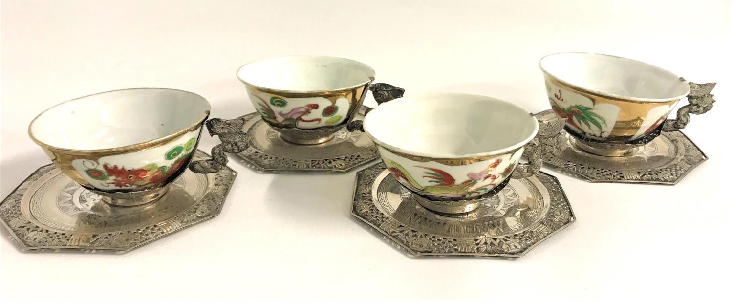 SET OF FOUR CHINESE TEA BOWLS with dragon and rooster decoration with gilt highlights and