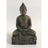 BRASS BUDDHA sat crossed leg on a plinth supported by mythical beasts 20cm high