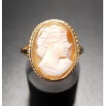 CAMEO DRESS RING the oval shell cameo depicting a female bust in profile, on nine carat gold