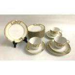 NORITAKE PART TEA SET with cream coloured and gilt border decoration, comprising seven cups,
