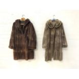 LADIES BROWN CONERY FUR COAT with side pockets, together with a light brown coney fur coat with side