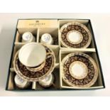 BOXED SALISBURY BONE CHINA COFFEE SET with gilt decoration, comprising six cups and saucers