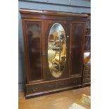 A 19th CENTURY MAHOGANY AND SATINWOOD INLAID THREE DOOR WARDROBE,