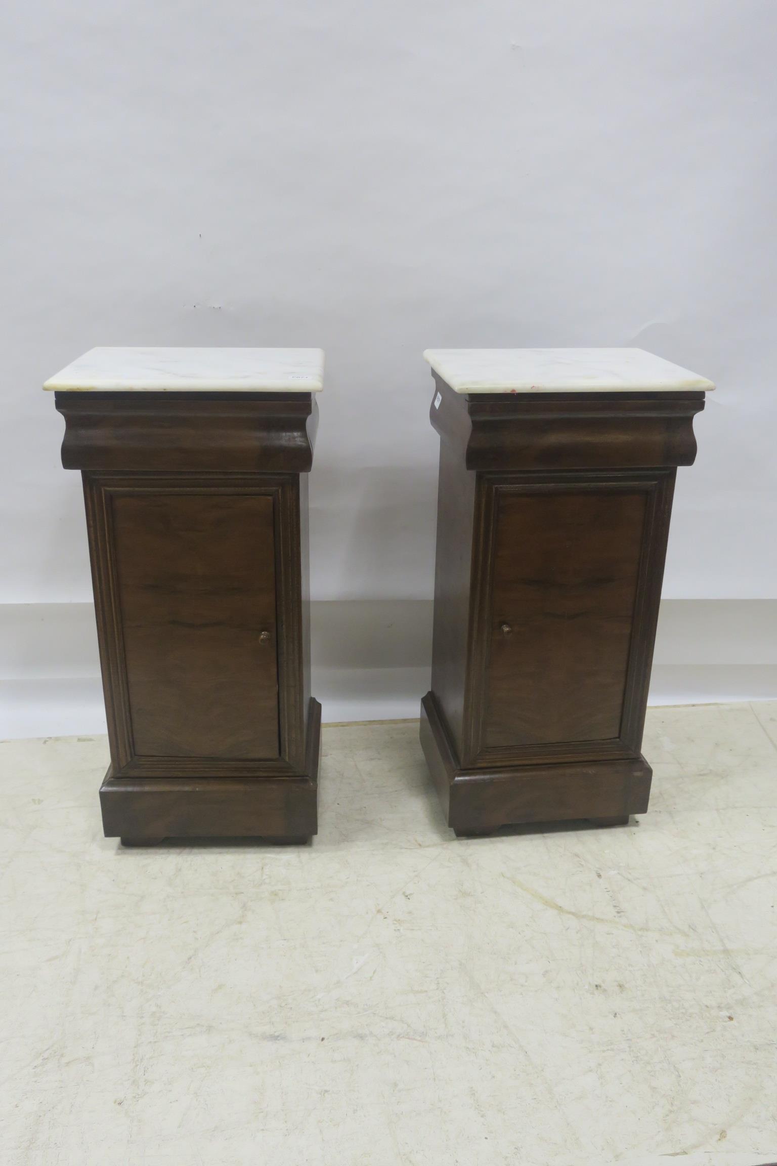 A PAIR OF MAHOGANY PEDESTALS,