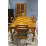 A SIMULATED OAK AND WALNUT EIGHT PIECE DINING ROOM SUITE, comprising six chairs,