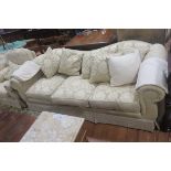 A THREE SEATER SETTEE,