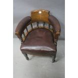 A 19TH CENTURY MAHOGANY LIBRARY TUB SHAPED CHAIR the scrolled top rail with upholstered arm rests