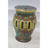 A MAJOLICA SEAT, of cylindrical tapering form the light brown,