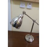 A CHROME ADJUSTABLE DESK LAMP,