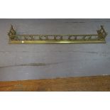 A 19th CENTURY BRASS FENDER,