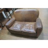 A FRENCH HIDE UPHOLSTERED TWO SEATER SETTEE,