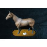 A BESWICK FIGURE, modelled as Arkle, Champion Steeplechaser,