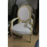 A PAIR OF CONTINENTAL WHITE PAINTED PARCEL GILT SALON CHAIRS,