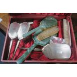 A FIVE PIECE SILVER ENGINE TURNED DRESSING TABLE SET comprising brushes,