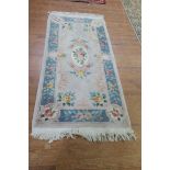 A CHINESE WOOL RUG,