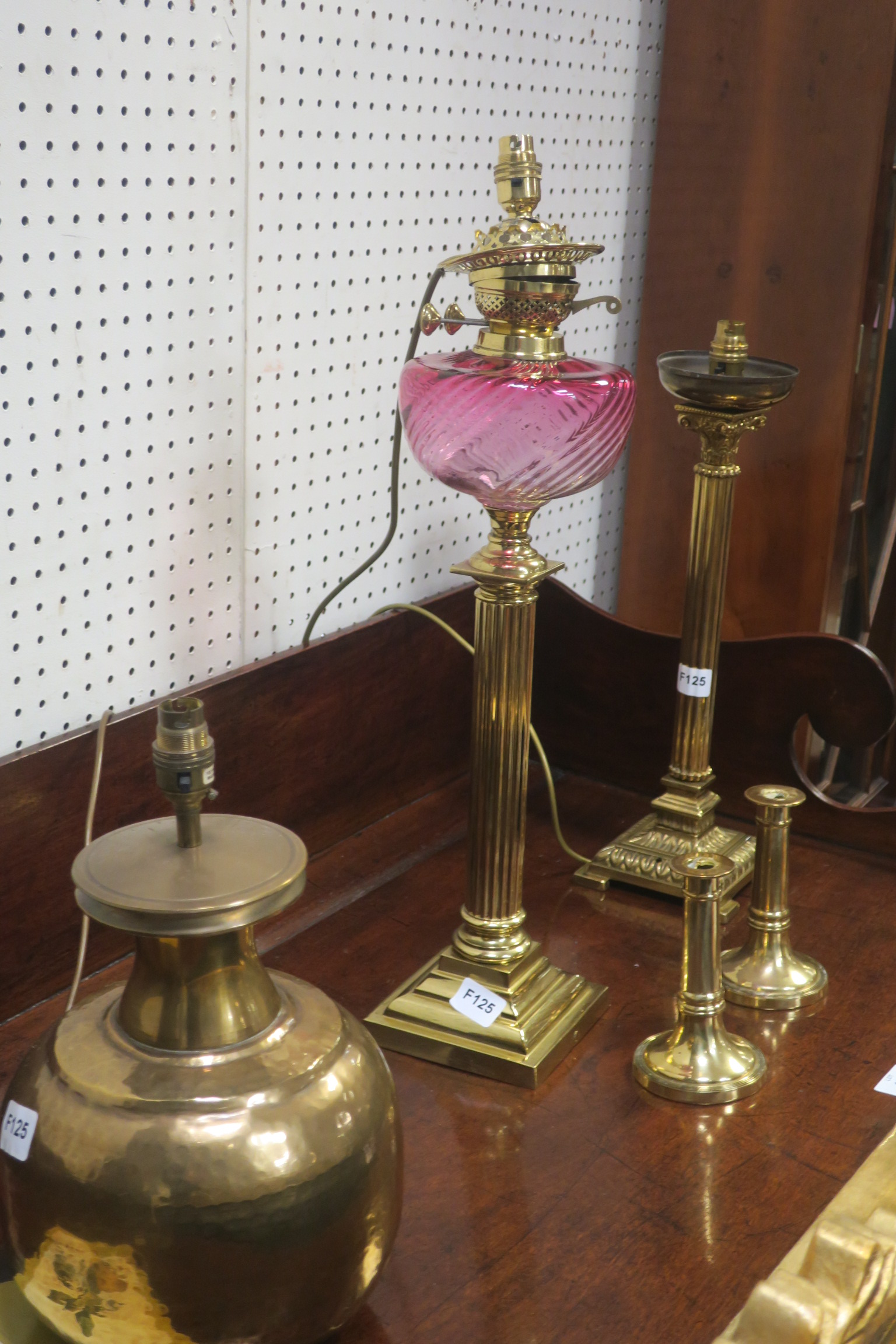 A 19th CENTURY BRASS OIL LAMP, with ruby glass reservoir, together with a reeded column table lamp,