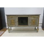 A CONTINENTAL GREY PAINTED AND PARCEL GILT SIDE CABINET,