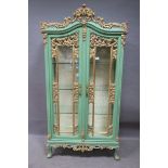 A CONTINENTAL POLYCHROME AND GILT DISPLAY CABINET,