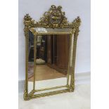 A CONTINENTAL GILT FRAME COMPARTMENTED MIRROR,