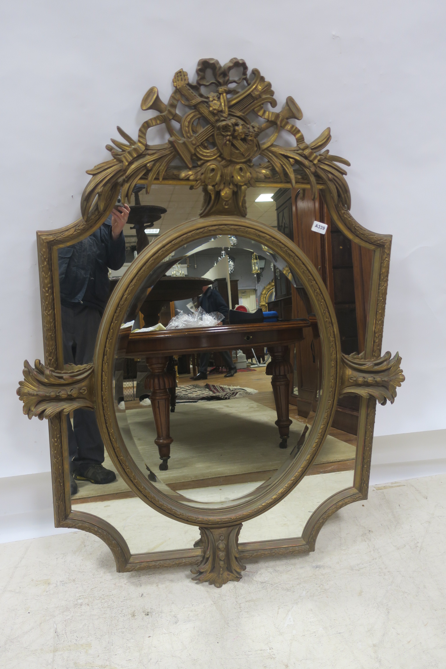 A CONTINENTAL GILT FRAME COMPARTMENTED MIRROR,