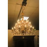 A VERY FINE AND IMPRESSIVE CONTINENTAL GILT BRASS AND CUT GLASS 36 BRANCH CHANDELIER,
