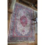 A PERSIAN SILK AND WOOL RUG, the white,