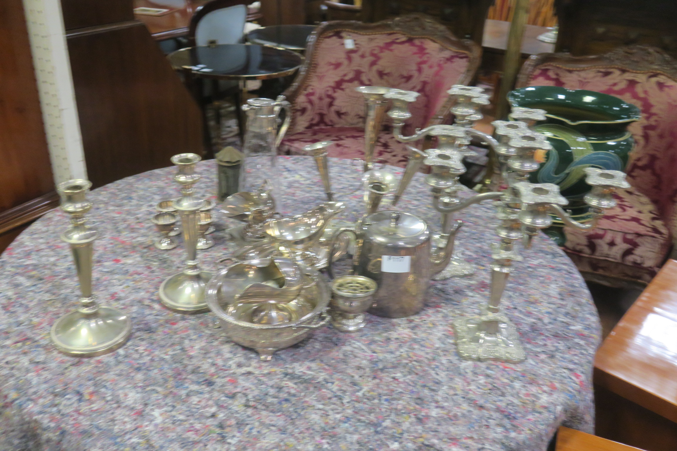 A COLLECTION OF PLATED WARE, to include candelabra, claret jug, sauce boats, candlesticks, etc.