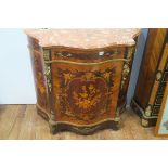 A CONTINENTAL KINGWOOD MARQUETRY AND GILT BRASS MOUNTED SIDE CABINET of serpentine outline