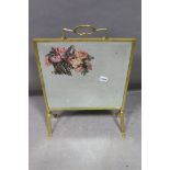 A BRASS PAINTED MIRRORED FIRESCREEN,