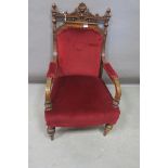 A GOTHIC DESIGN MAHOGANY AND UPHOLSTERED ARMCHAIR,