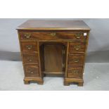 A GEORGIAN MAHOGANY KNEE HOLE DESK,