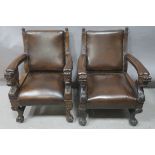 TWO VERY FINE IRISH 19th CENTURY CARVED OAK AND HIDE UPHOLSTERED GREAT HALL CHAIRS,