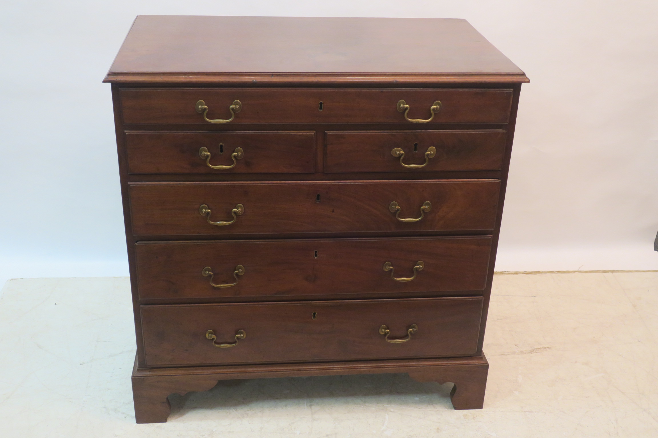 A FINE GEORGIAN MAHOGANY CHEST, the rectangular top above one long,