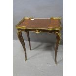 A CONTINENTAL KINGWOOD PARQUETRY AND GILT BRASS MOUNTED TABLE of serpentine outline with pierced