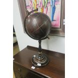 A METAL AND LEATHER BOUND GLOBE,