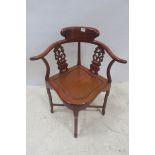 AN ORIENTAL HARDWOOD CORNER CHAIR,