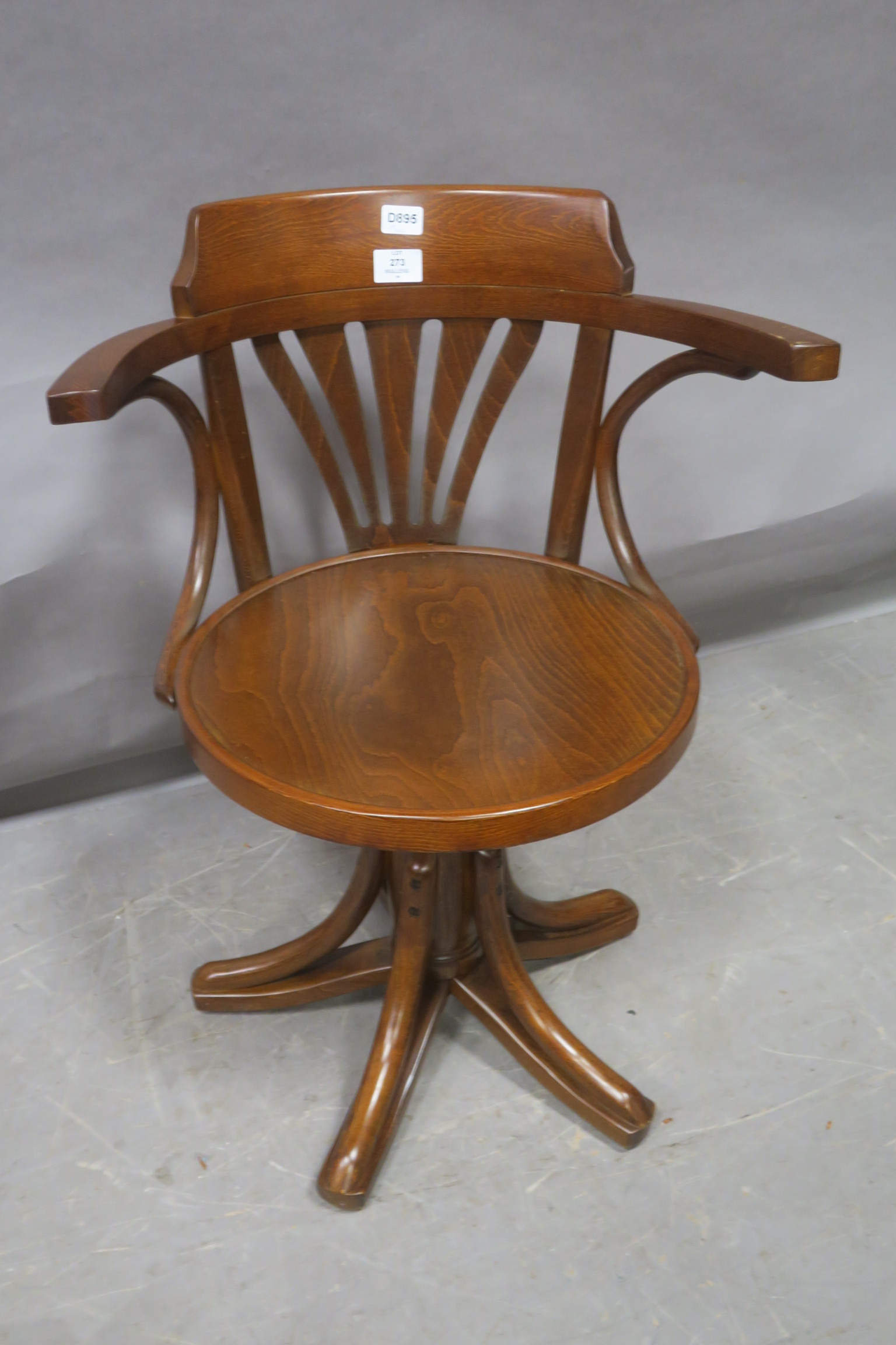 A BENTWOOD SWIVEL ELBOW CHAIR,