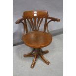 A BENTWOOD SWIVEL ELBOW CHAIR,