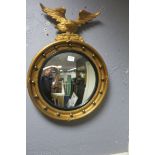 A GILT PLASTER CONVEX MIRROR,