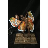 AN ART DECO DESIGN BRONZE AND COLOURED GLASS FIGURAL TABLE LAMP,